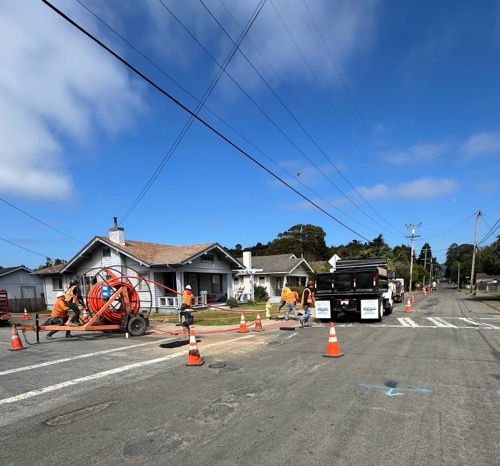 Construction crews out on road deploying fiber cables