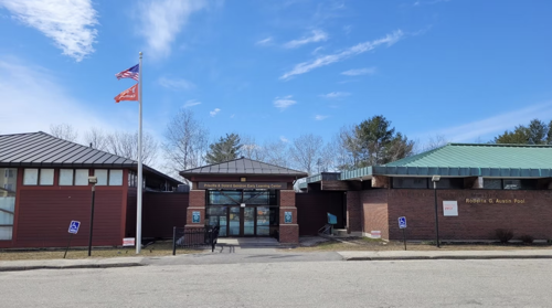 Maine learning center brick building with flag out front