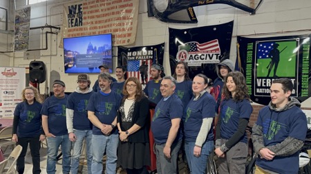 A graduating apprentice class of about a dozen future technicians pose for class photo