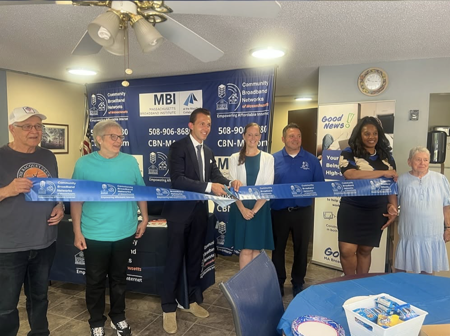 MBI and CBN officials cut blue tape at ceremony
