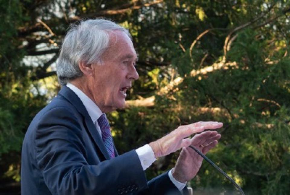 Sen. Ed Markey speaks using hand gestures at podium