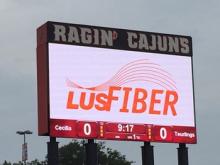 LUS Fiber logo on high school scoreboard